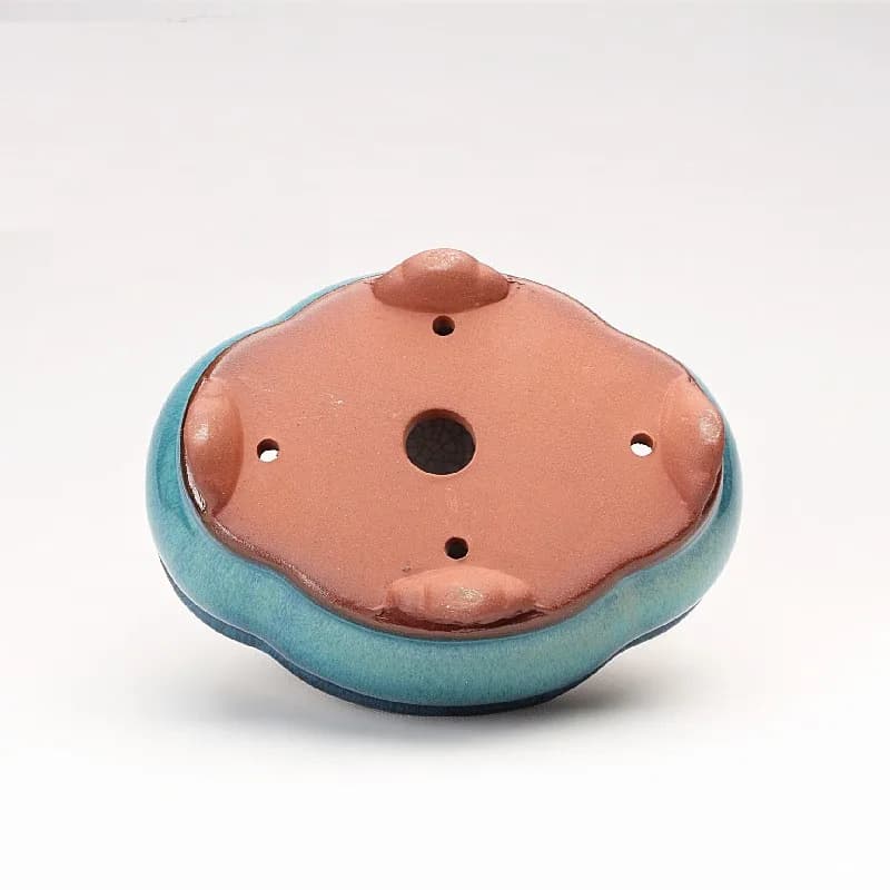 Base ventilada do vaso de flores bonsai chinês em cerâmica azul-turquesa com detalhes em terracota