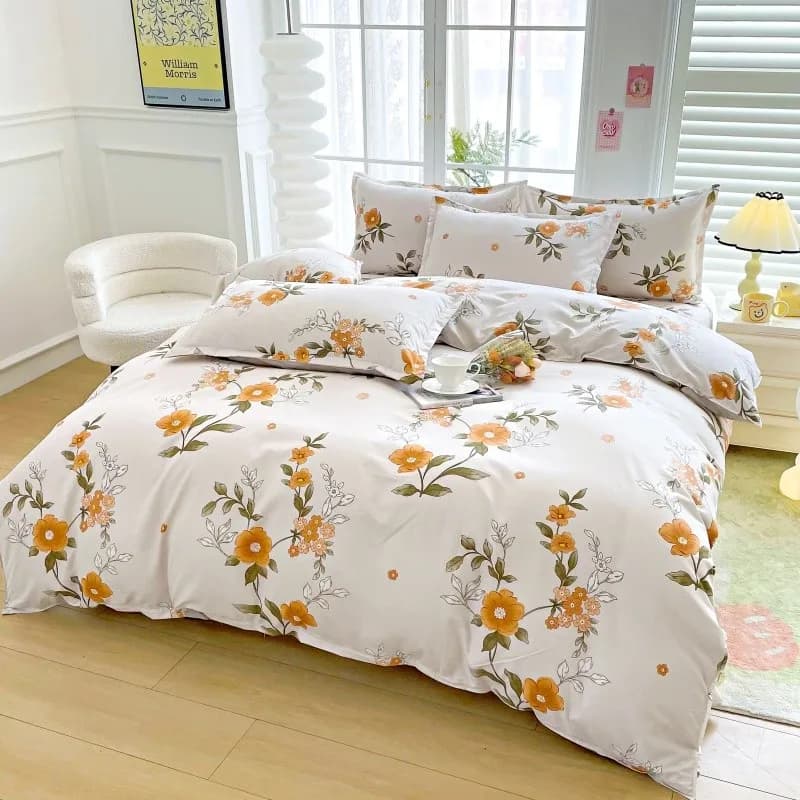Conjunto de roupa de cama floral amarelo com estampa de flores.
