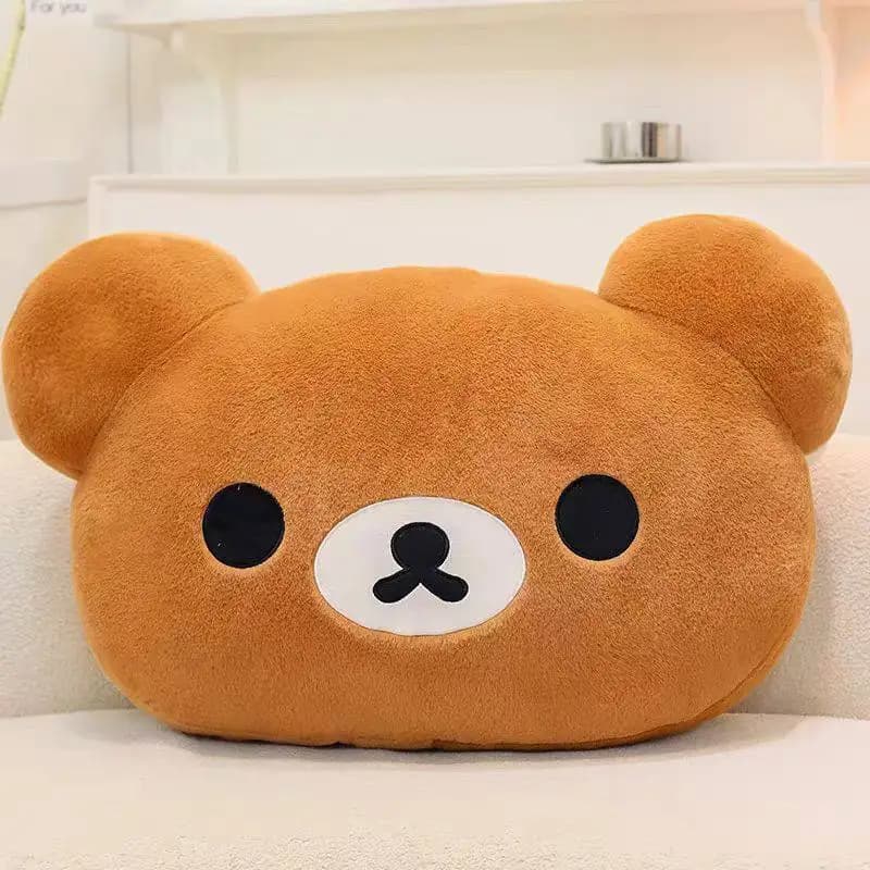 Almofada de pelúcia Fan Rong Rilakkuma bege macia em formato de cabeça de urso sobre superfície clara