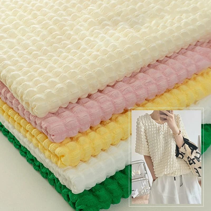 Tecido macio elástico xadrez em várias cores para costura, em camadas com textura de bolha e waffle.