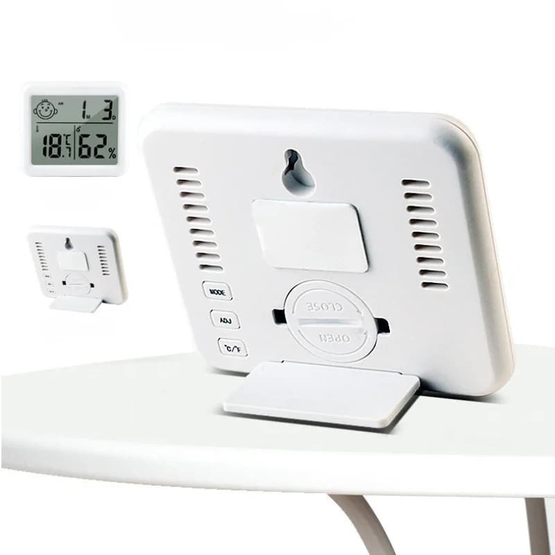 Termo-higrômetro digital branco com suporte de mesa e visor LCD mostrando temperatura e umidade