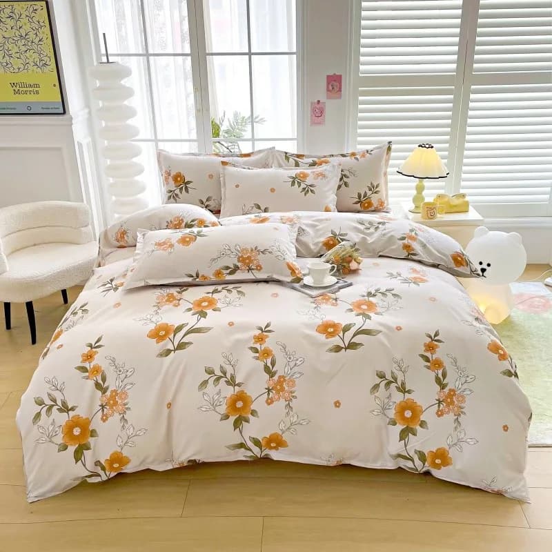Conjunto de roupa de cama floral amarelo com estampa de flores brancas e amarelo.