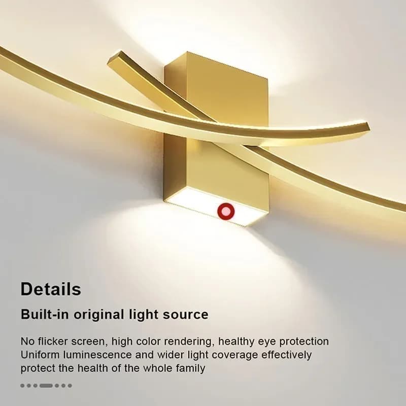 Detalhe da luminária de parede LED dourada com fonte de luz embutida e design curvo moderno
