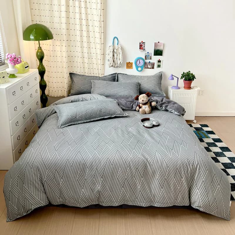 Conjunto de cama geométrico cinza com estampa listrada chevron
