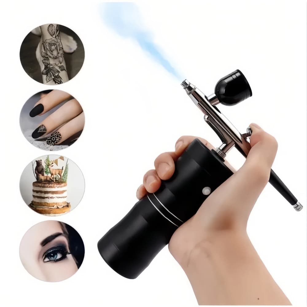 Aerógrafo recarregável portátil preto em uso, aplicador de tinta em unhas, bolo e rosto, fundo branco.