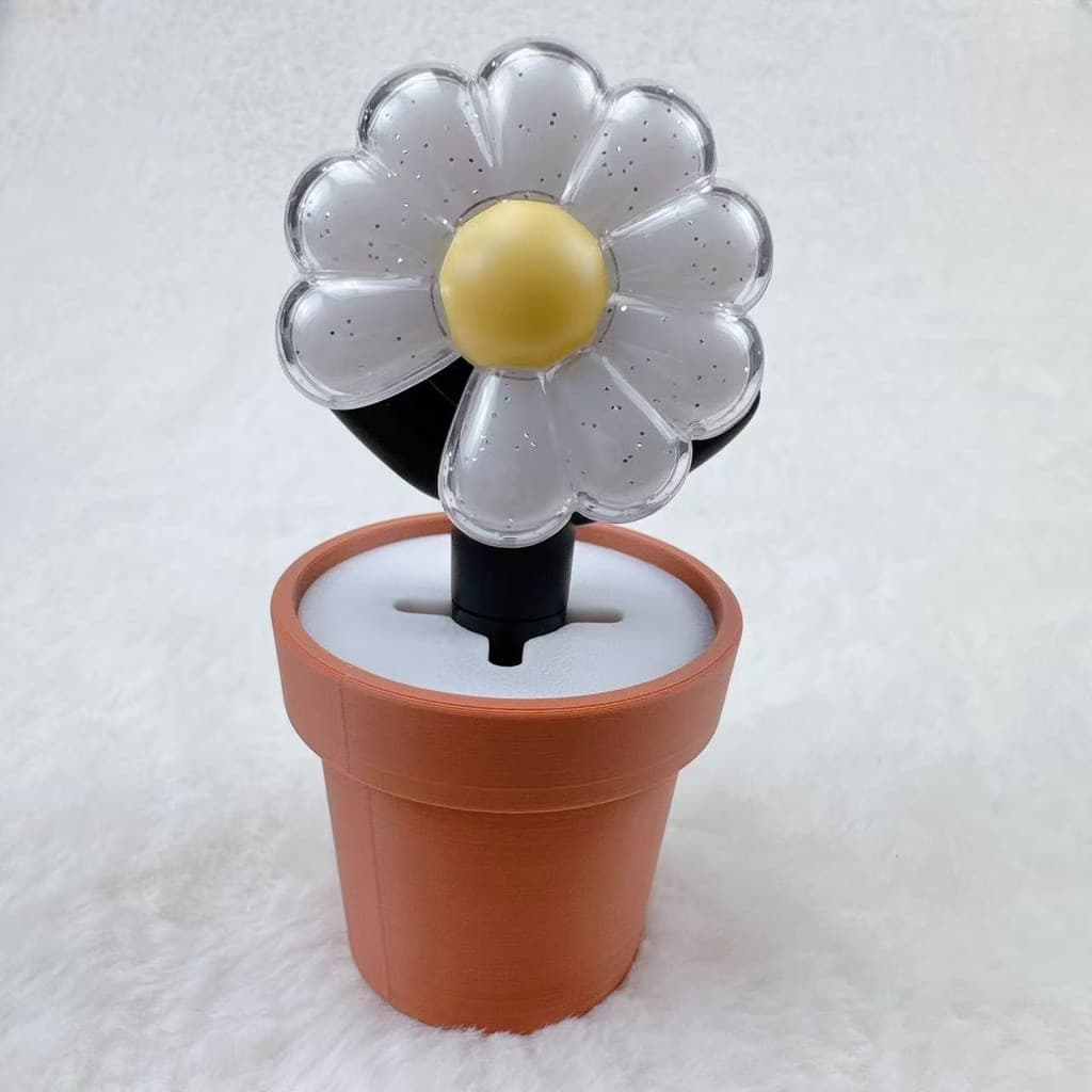 Chaveiro de margaridas luminosas em mini vaso marrom