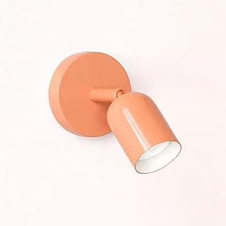 Luminária de parede rosa estilo nórdico com luz acesa