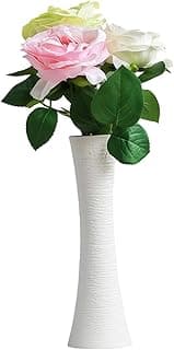 Vaso de cerâmica branco com flores artificiais rosa, branca e amarela