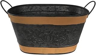 Vaso metálico preto e marrom com alças e padrão decorativo em relevo.