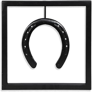 Quadro decorativo com ferradura preta em moldura preta e fundo branco