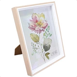 Porta retrato decorativo branco com flor rosa e folhas verdes