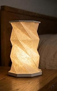 Luminária de mesa recarregável sem fio, design geométrico dobrável, cor bege, iluminação suave.