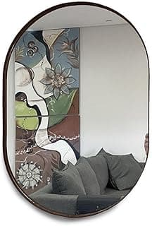 Espelho oval 60x40cm com moldura cor café refletindo sala de estar