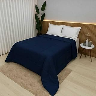 Edredom azul marinho solteiro com duplo-face em quarto moderno