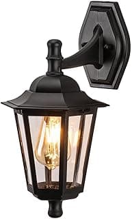 Luminária de parede colonial preta com lente transparente e luz acesa