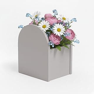 Cachepot cinza para flores com flores coloridas dentro, para decoração de mesa.