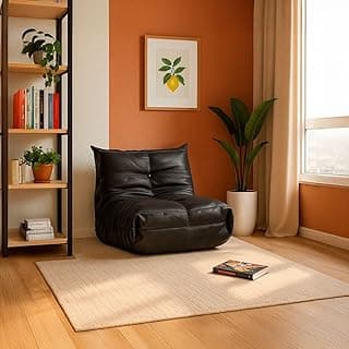 Poltrona retrô preta em ambiente moderno com fundo laranja