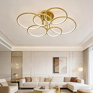 Luminária de teto LED moderna em metal dourado com seis anéis, iluminando uma sala de estar.