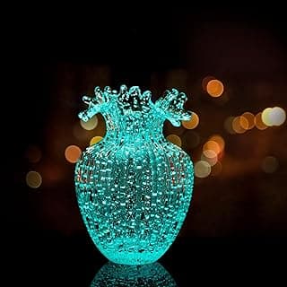 Vaso de vidro decorativo vintage com ondas luminosas em verde, ideal para decoração de sala de estar ou jantar.