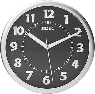 Relógio de parede Seiko preto e branco com números luminosos