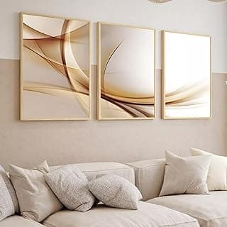 Quadros decorativos abstratos em marrom e dourado com molduras bege pendurados na parede