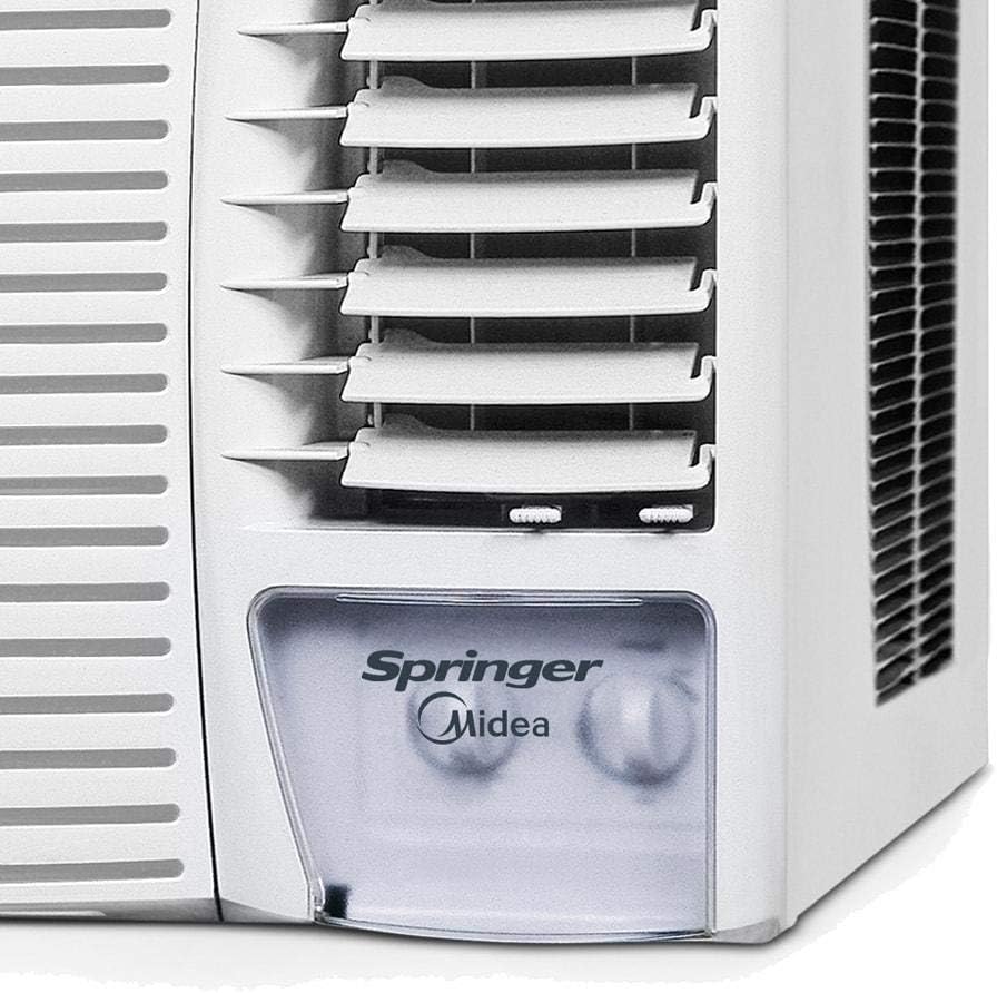 Painel de controle mecânico branco do ar condicionado de janela Springer Midea com duas manoplas e logo visível, próximo às aletas de saída de ar.